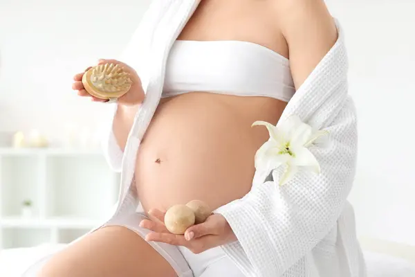 Young Pregnant Woman Massage Brush Balls Spa Salon Closeup Fotos de stock