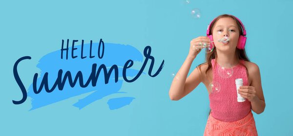 Cute little girl with headphones blowing soap bubbles and text HELLO, SUMMER on blue background