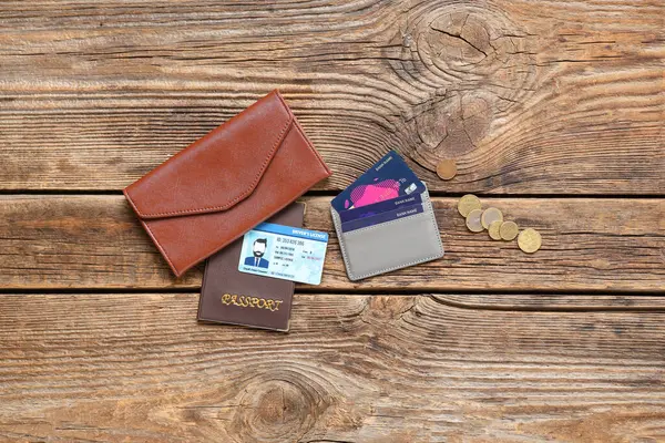 Composition with credit card holder, wallet and documents on wooden background