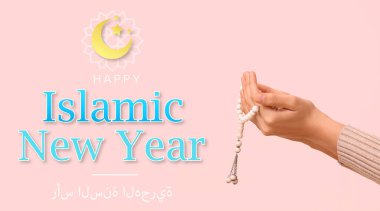 Hands of praying Muslim woman with beads on pink background. Greeting banner for Islamic New Year