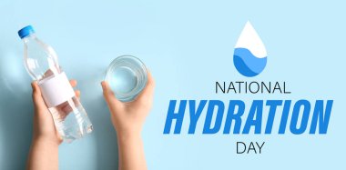 Female hands with bottle of clean water and glass on blue background. Banner for National Hydration Day