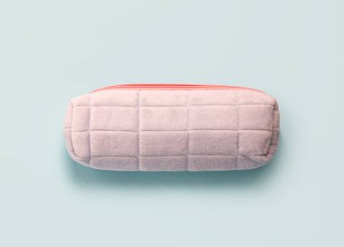 Pencil case on blue background