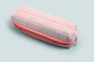 Pencil case on blue background