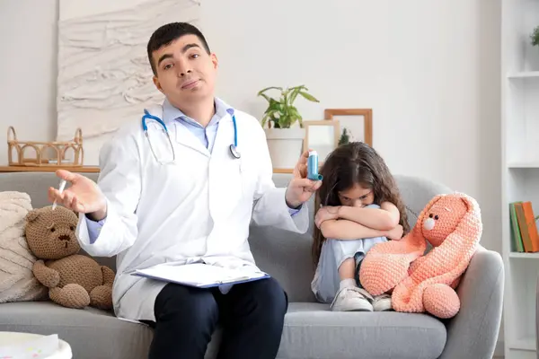 stock image Upset little girl and doctor with inhaler at home