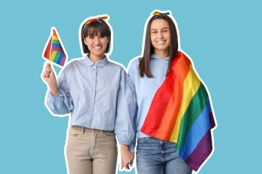 Açık mavi arka planda LGBT bayrakları olan mutlu genç lezbiyen çift