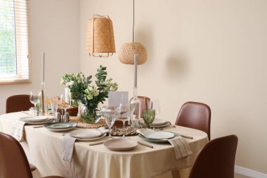 Beautiful table setting with eustoma flowers for wedding celebration in room