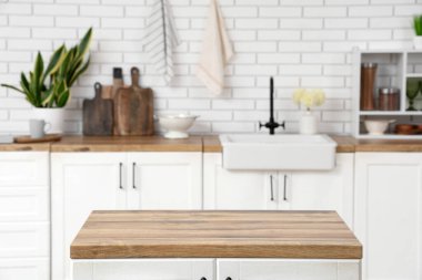 Clean wooden counter in interior of light kitchen
