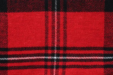 Arkaplan olarak kırmızı ekose kumaş dokusu yakın görünüm