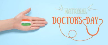 Hand with drawn flag of India and text NATIONAL DOCTOR'S DAY on light blue background clipart