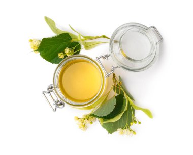 Beyaz arkaplanda ıhlamur balı kavanoz