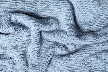 Arka planda kıvrımları olan şık örülmüş kumaş dokusu