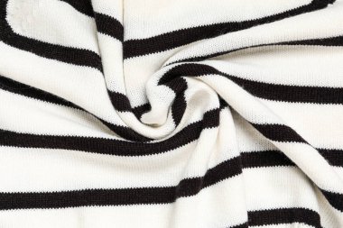 Arka planda kıvrımları olan şık örülmüş kumaş dokusu