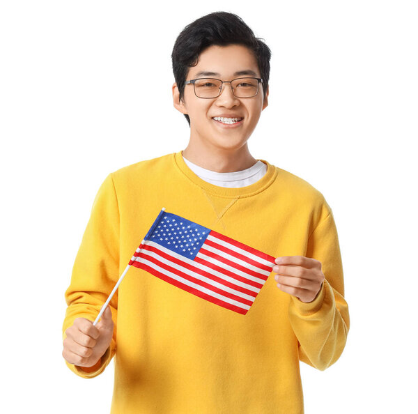Young Asian man with USA flag on white background
