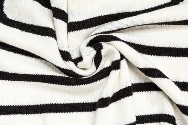 Arka planda kıvrımları olan şık örülmüş kumaş dokusu