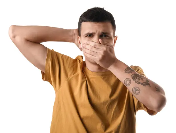 stock image Handsome young man feeling bad smell from armpits on white background