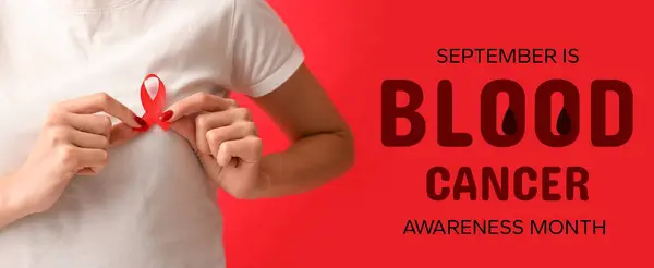 stock image Woman with red ribbon on color background, closeup. Banner for Blood Cancer Awareness Month