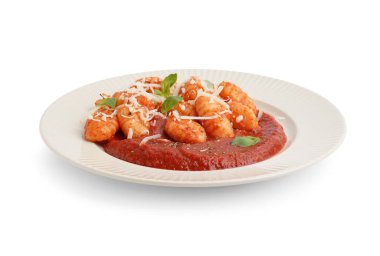 Plate of tasty gnocchi with tomato sauce and cheese on white background clipart