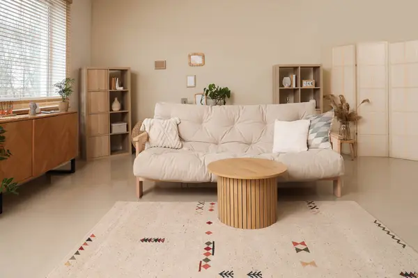 stock image Interior of cozy living room with couch, table and shelf units