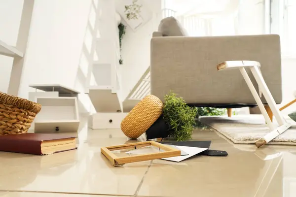 stock image Overturned things on floor in messy living room