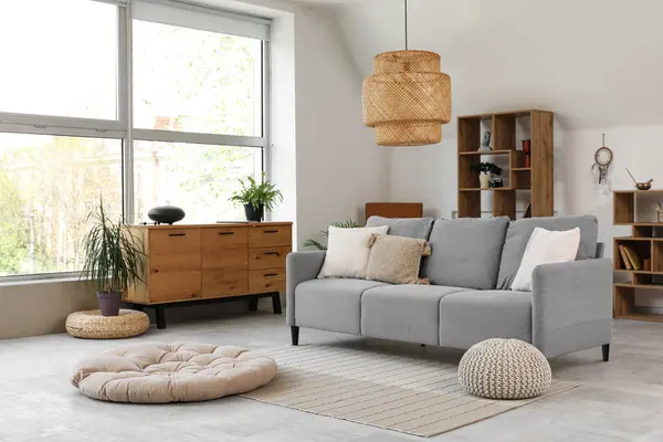 stock image Interior of living room with sofa and glucophone on drawers