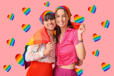 Pembe arka planda LGBT bayrağı olan genç lezbiyen çift