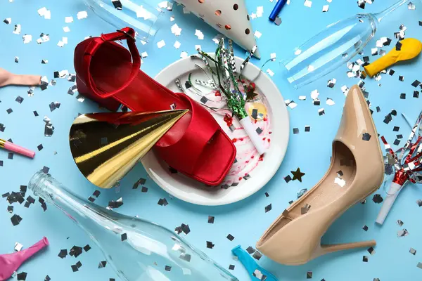 stock image Composition with stylish female shoes, dirty tableware and party decor on color background