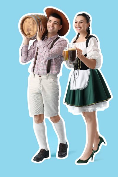 Young couple in traditional German clothes and with beer on blue background