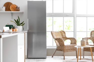 Interior of modern kitchen with refrigerator clipart