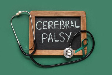 Renkli CEREBRAL PALSY yazı tahtası, yeşil kurdele ve steteskop