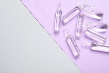 Renk arkaplanındaki cam ampules