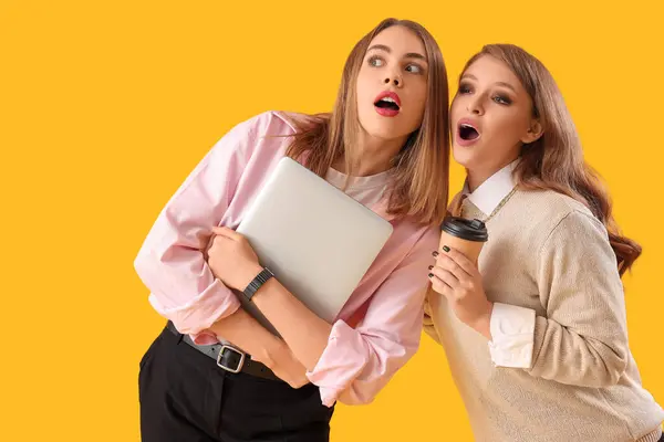 stock image Business colleagues gossiping on yellow background