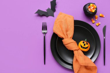 Cadılar Bayramı balkabağı, yarasa ve şeker arkaplanlı şenlik masası