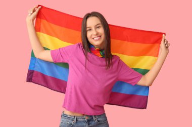 Beautiful young woman with LGBT flag on pink background clipart