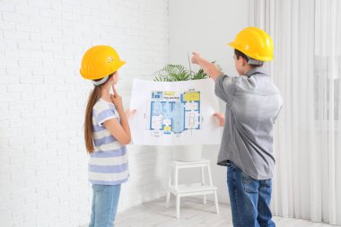 Ev planı olan küçük mimarlar, arka plan.