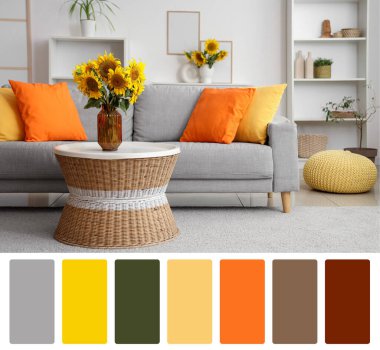 Gri kanepesi ve vazoları ayçiçekleri olan şık bir oturma odası. Farklı renk desenleri