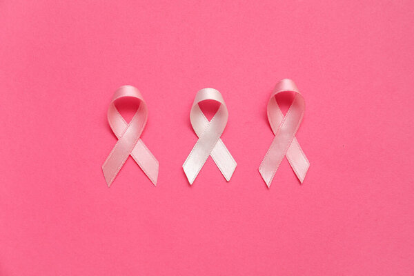 Silk ribbons on pink background. Breast cancer concept