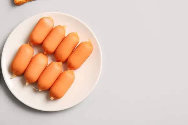 stock image Plate of tasty boiled sausages on grey background