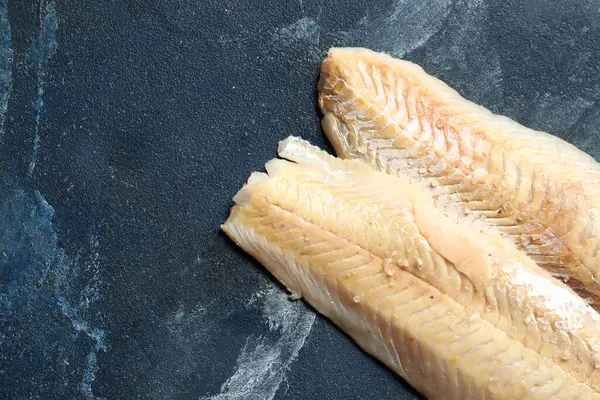 stock image Raw codfish fillet on blue background