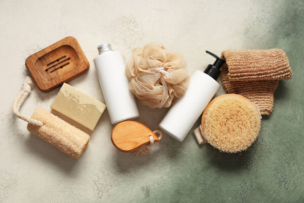 Composition with different bath supplies and cosmetic products on grunge background
