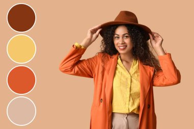 Bej arka planda sonbahar kıyafeti giymiş genç bir Afro-Amerikalı kadın. Farklı renk desenleri