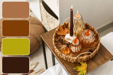 Odada yanan mum olan dekoratif balkabakları. Farklı renk desenleri