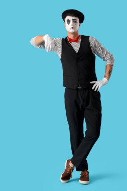 Male pantomimist on blue background clipart