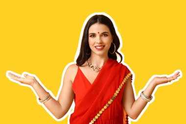 Sarı arka planda kırmızı sarili güzel Hintli kadın.