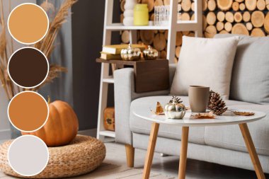 Sonbahar dekoru, kanepesi ve masası olan bir oturma odası. Farklı renk desenleri