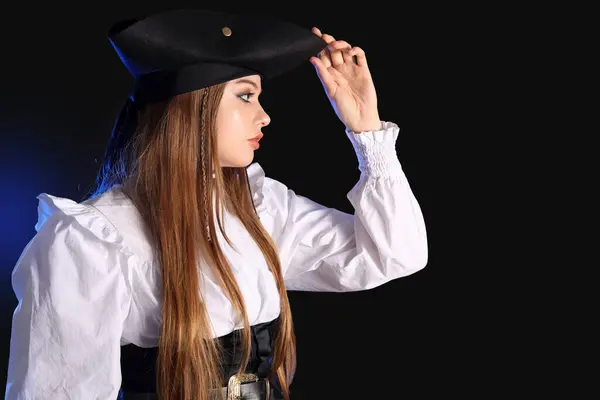 stock image Beautiful female pirate on black background