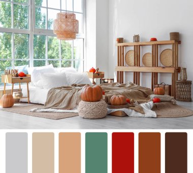 Sonbahar balkabaklarıyla dolu modern rahat bir yatak odası. Farklı renk desenleri