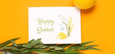 Four species (lulav, hadas, arava, etrog) and greeting card with text HAPPY SUKKOT on orange background clipart