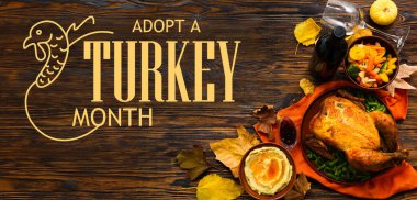 Tahta arka planda Şükran Günü için şenlik yemekleri. Türkiye 'yi Evlat Edinme Ayının Sancağı