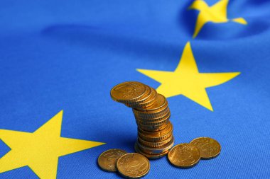 Coins and European Union flag, closeup