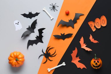 Kâğıt yarasalar kelime BOO, örümcekler, kemikler ve balkabakları renkli arka planda Cadılar Bayramı partisi için